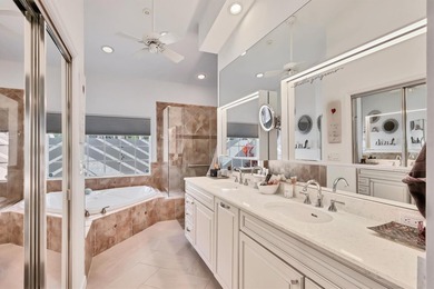 Walk through the front gate and courtyard to discover refined on The Meadows Golf and Country Club in Florida - for sale on GolfHomes.com, golf home, golf lot