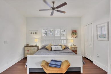 Walk through the front gate and courtyard to discover refined on The Meadows Golf and Country Club in Florida - for sale on GolfHomes.com, golf home, golf lot