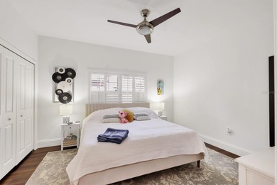 Walk through the front gate and courtyard to discover refined on The Meadows Golf and Country Club in Florida - for sale on GolfHomes.com, golf home, golf lot