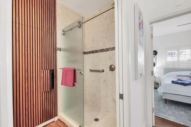 Walk through the front gate and courtyard to discover refined on The Meadows Golf and Country Club in Florida - for sale on GolfHomes.com, golf home, golf lot