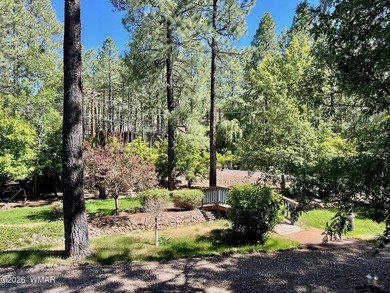 Tucked among the tall pines of Pinetop Country Club, this on Pinetop Lakes Country Club in Arizona - for sale on GolfHomes.com, golf home, golf lot
