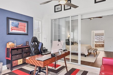 Walk through the front gate and courtyard to discover refined on The Meadows Golf and Country Club in Florida - for sale on GolfHomes.com, golf home, golf lot