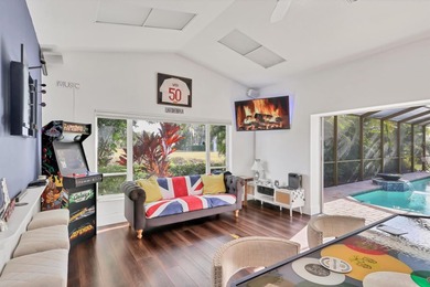 Walk through the front gate and courtyard to discover refined on The Meadows Golf and Country Club in Florida - for sale on GolfHomes.com, golf home, golf lot