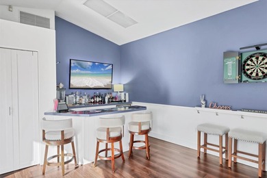 Walk through the front gate and courtyard to discover refined on The Meadows Golf and Country Club in Florida - for sale on GolfHomes.com, golf home, golf lot