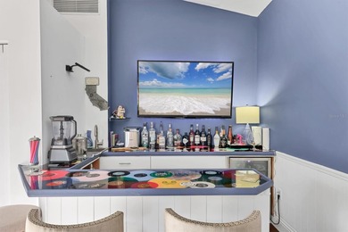 Walk through the front gate and courtyard to discover refined on The Meadows Golf and Country Club in Florida - for sale on GolfHomes.com, golf home, golf lot