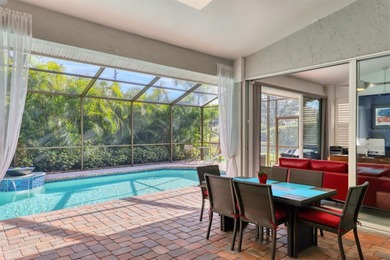 Walk through the front gate and courtyard to discover refined on The Meadows Golf and Country Club in Florida - for sale on GolfHomes.com, golf home, golf lot