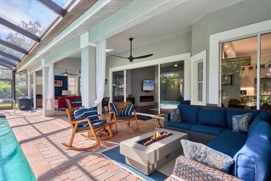 Walk through the front gate and courtyard to discover refined on The Meadows Golf and Country Club in Florida - for sale on GolfHomes.com, golf home, golf lot