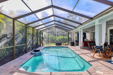 Walk through the front gate and courtyard to discover refined on The Meadows Golf and Country Club in Florida - for sale on GolfHomes.com, golf home, golf lot