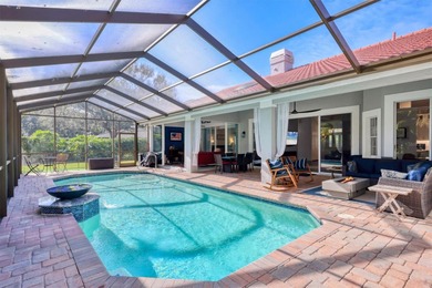 Walk through the front gate and courtyard to discover refined on The Meadows Golf and Country Club in Florida - for sale on GolfHomes.com, golf home, golf lot