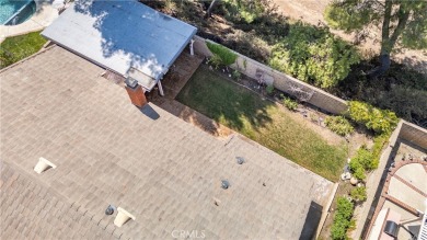 This Single Story home is nestled amidst gently rolling hills in on Vista Valencia Golf Course in California - for sale on GolfHomes.com, golf home, golf lot