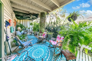Lots of natural light streams into this cheerful beach retreat on Seascape Golf Course in Florida - for sale on GolfHomes.com, golf home, golf lot