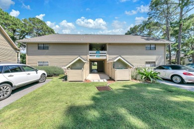 Lots of natural light streams into this cheerful beach retreat on Seascape Golf Course in Florida - for sale on GolfHomes.com, golf home, golf lot