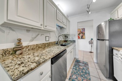 Lots of natural light streams into this cheerful beach retreat on Seascape Golf Course in Florida - for sale on GolfHomes.com, golf home, golf lot
