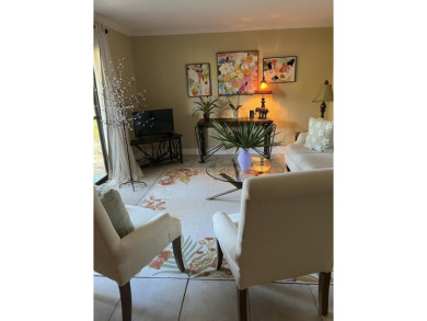 Lots of natural light streams into this cheerful beach retreat on Seascape Golf Course in Florida - for sale on GolfHomes.com, golf home, golf lot