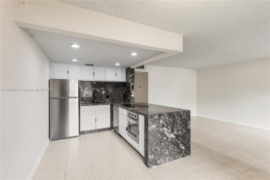 !! LOCATED ON THE FIRST FLOOR ... AND WITH GOLF COURSE VIEW on Flamingo Lakes Country Club in Florida - for sale on GolfHomes.com, golf home, golf lot