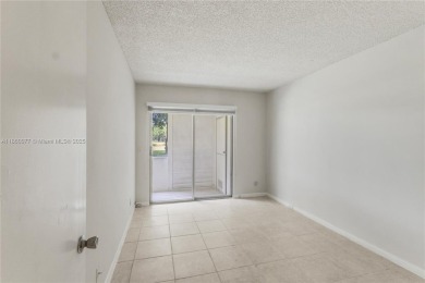 !! LOCATED ON THE FIRST FLOOR ... AND WITH GOLF COURSE VIEW on Flamingo Lakes Country Club in Florida - for sale on GolfHomes.com, golf home, golf lot