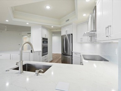 THIS CONDOMINIUM SOUNDS LIKE A DREAM COME TRUE. THE COMBINATION on Hammock Bay in Florida - for sale on GolfHomes.com, golf home, golf lot