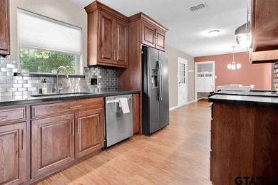 Welcome to this inviting 3-bedroom, 2 bath brick home featuring on Hide-A-Way Lake Golf Course in Texas - for sale on GolfHomes.com, golf home, golf lot