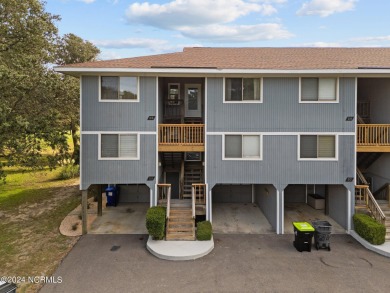 Wonderful end unit in Caswell Dunes overlooking the golf course on Oak Island Golf Club in North Carolina - for sale on GolfHomes.com, golf home, golf lot