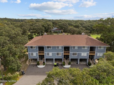 Wonderful end unit in Caswell Dunes overlooking the golf course on Oak Island Golf Club in North Carolina - for sale on GolfHomes.com, golf home, golf lot