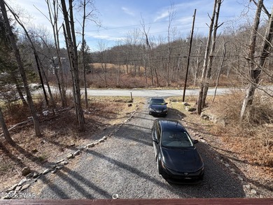 Welcome to this spacious and inviting 4-bedroom, 2-bath home on The Hideout Golf in Pennsylvania - for sale on GolfHomes.com, golf home, golf lot