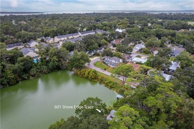 This South-end bungalow offers beautiful views of Lake Worth in on Sea Island Golf Club in Georgia - for sale on GolfHomes.com, golf home, golf lot