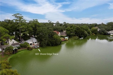 This South-end bungalow offers beautiful views of Lake Worth in on Sea Island Golf Club in Georgia - for sale on GolfHomes.com, golf home, golf lot