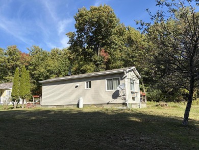 This charming lakeside retreat, offers the perfect opportunity on Willsboro Golf Club in New York - for sale on GolfHomes.com, golf home, golf lot