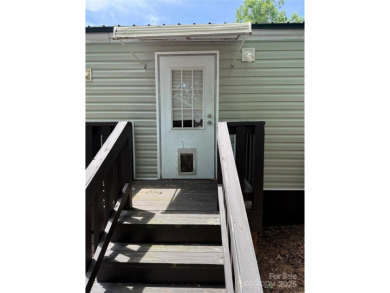 Welcome to 102 Papoose Ct. This 1999 Park Model is in great on The Tillery Tradition Country Club in North Carolina - for sale on GolfHomes.com, golf home, golf lot