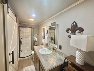 This stunning 2-bedroom, 2-bath partially furnished manufactured on Pendleton Harbor in Texas - for sale on GolfHomes.com, golf home, golf lot