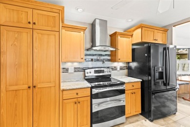 Welcome to your dream home in one of Dunedin's most desirable on The Dunedin Country Club in Florida - for sale on GolfHomes.com, golf home, golf lot