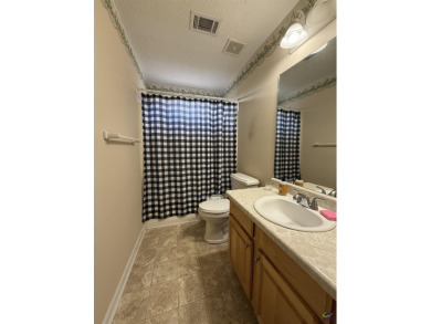 Welcome to this spacious 4-bedroom, 2-bath home in the highly on The International City Golf Course in Georgia - for sale on GolfHomes.com, golf home, golf lot