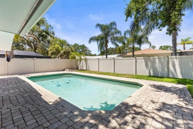 Welcome to your dream home in one of Dunedin's most desirable on The Dunedin Country Club in Florida - for sale on GolfHomes.com, golf home, golf lot