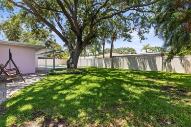 Welcome to your dream home in one of Dunedin's most desirable on The Dunedin Country Club in Florida - for sale on GolfHomes.com, golf home, golf lot