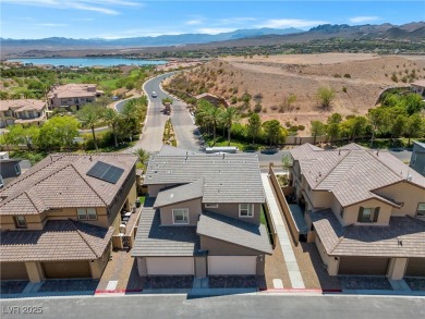 Nestled within a picturesque embrace of a serene lake and golf on Reflection Bay Golf Club in Nevada - for sale on GolfHomes.com, golf home, golf lot