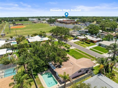 Welcome to your dream home in one of Dunedin's most desirable on The Dunedin Country Club in Florida - for sale on GolfHomes.com, golf home, golf lot