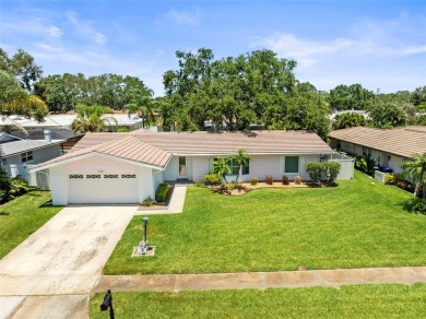 Welcome to your dream home in one of Dunedin's most desirable on The Dunedin Country Club in Florida - for sale on GolfHomes.com, golf home, golf lot