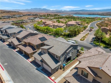 Nestled within a picturesque embrace of a serene lake and golf on Reflection Bay Golf Club in Nevada - for sale on GolfHomes.com, golf home, golf lot