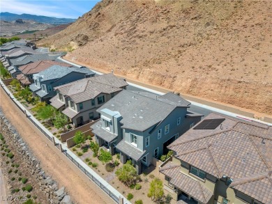 Nestled within a picturesque embrace of a serene lake and golf on Reflection Bay Golf Club in Nevada - for sale on GolfHomes.com, golf home, golf lot