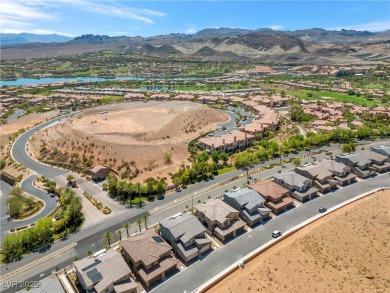 Nestled within a picturesque embrace of a serene lake and golf on Reflection Bay Golf Club in Nevada - for sale on GolfHomes.com, golf home, golf lot