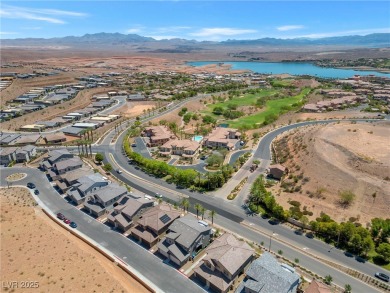 Nestled within a picturesque embrace of a serene lake and golf on Reflection Bay Golf Club in Nevada - for sale on GolfHomes.com, golf home, golf lot