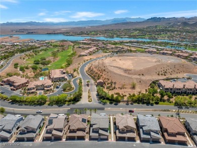 Nestled within a picturesque embrace of a serene lake and golf on Reflection Bay Golf Club in Nevada - for sale on GolfHomes.com, golf home, golf lot