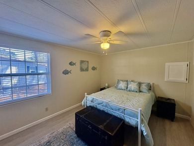 Move-In Ready 55+ Coastal Retreat with Water Views--short golf on Indigo Creek Golf Club in South Carolina - for sale on GolfHomes.com, golf home, golf lot