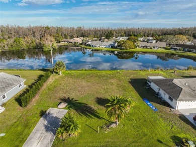 OVERSIZED VACANT LOT WITH 94 FRONT FT OF BEAUTIFUL WATER VIEWS on Caloosa Greens Executive Golf Course in Florida - for sale on GolfHomes.com, golf home, golf lot