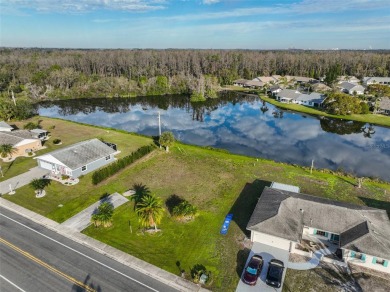 OVERSIZED VACANT LOT WITH 94 FRONT FT OF BEAUTIFUL WATER VIEWS on Caloosa Greens Executive Golf Course in Florida - for sale on GolfHomes.com, golf home, golf lot