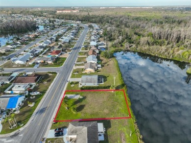 OVERSIZED VACANT LOT WITH 94 FRONT FT OF BEAUTIFUL WATER VIEWS on Caloosa Greens Executive Golf Course in Florida - for sale on GolfHomes.com, golf home, golf lot
