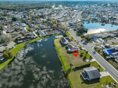 OVERSIZED VACANT LOT WITH 94 FRONT FT OF BEAUTIFUL WATER VIEWS on Caloosa Greens Executive Golf Course in Florida - for sale on GolfHomes.com, golf home, golf lot