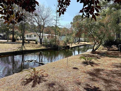 Move-In Ready 55+ Coastal Retreat with Water Views--short golf on Indigo Creek Golf Club in South Carolina - for sale on GolfHomes.com, golf home, golf lot