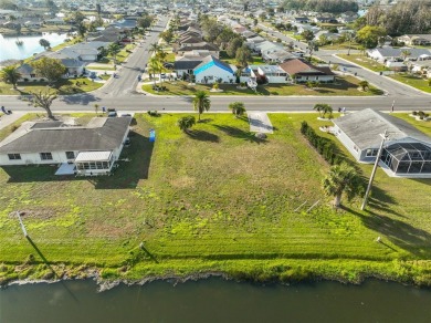 OVERSIZED VACANT LOT WITH 94 FRONT FT OF BEAUTIFUL WATER VIEWS on Caloosa Greens Executive Golf Course in Florida - for sale on GolfHomes.com, golf home, golf lot