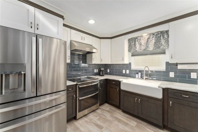 Welcome to this stunning FULLY UPDATED, 2-bedroom, 2-bathroom on Glenview Championship Golf and Country Club in Florida - for sale on GolfHomes.com, golf home, golf lot
